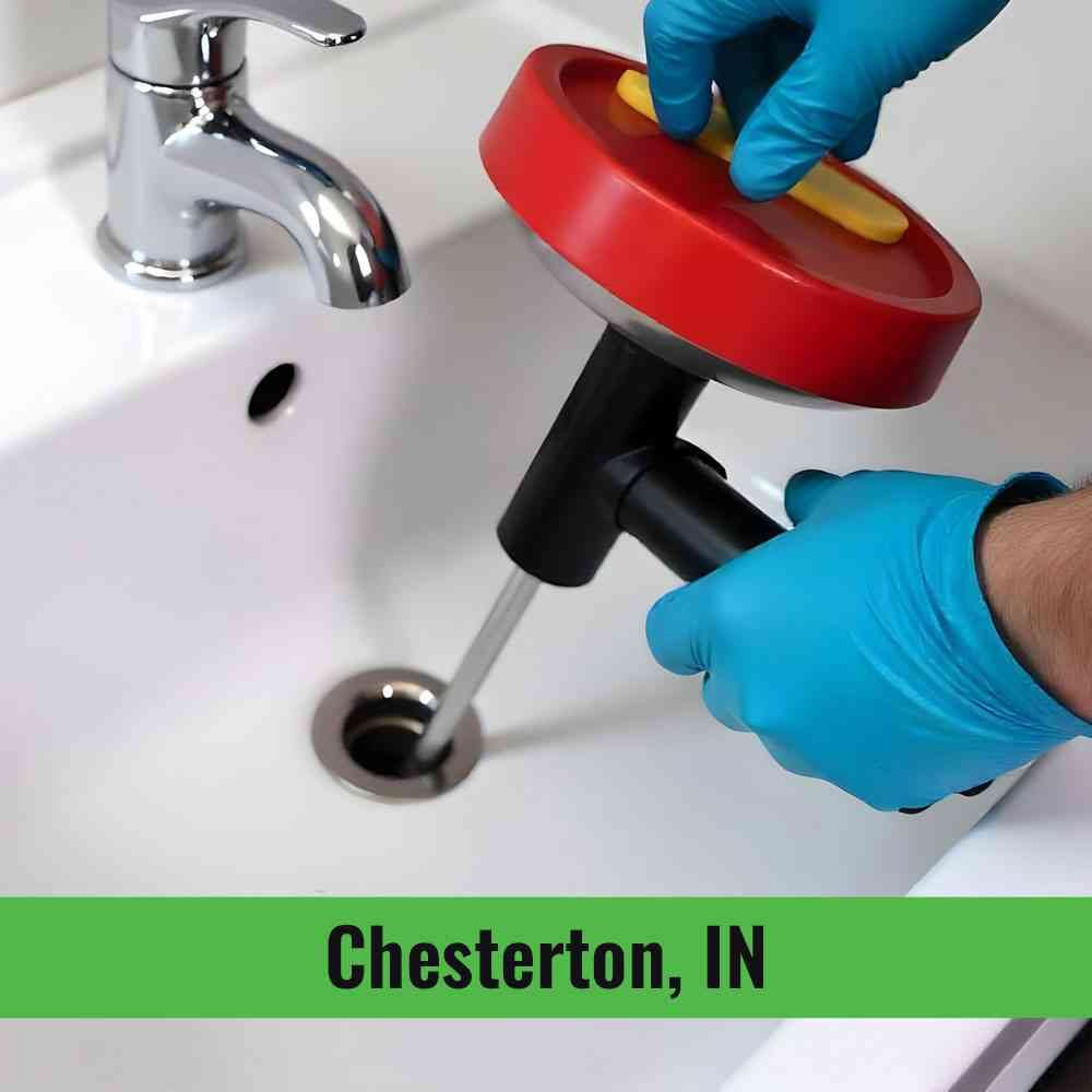 Professional drain cleaning Chesterton technician clearing a clogged drain in a local home